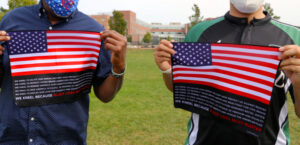 Two of the founders of the Black Lives Must Matter Kneel Flag